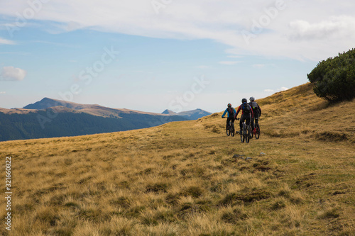 cyclists riding through mountain landscape in Transylvania