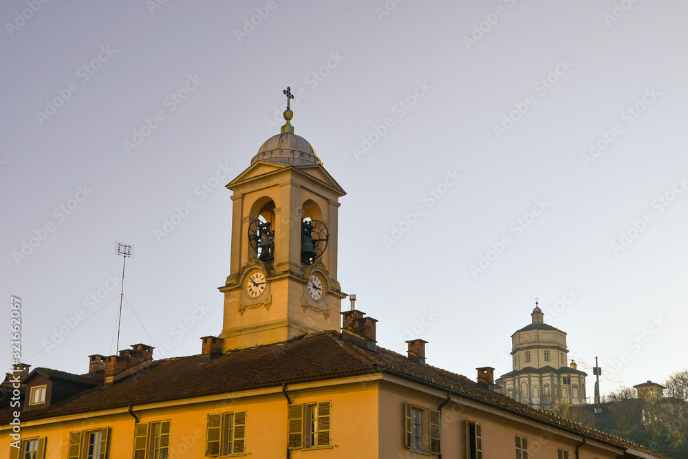 Bell tower of the Church of Gran Madre di Dio, located on the building adjacent to the church, and the Church of Santa Maria al Monte dei Cappuccini, Turin, Piedmont, Italy