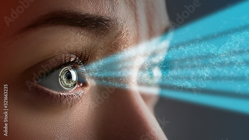 weigeren Bijdrage Onze onderneming Female eye close up with smart contact lens with digital and biometric  implants to scanning the ocular retina. Future concept and high tech  technology for computer scans of face id Stock Photo 