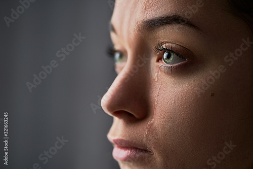 Fotografering Sad desperate crying woman with tears eyes during trouble, life difficulties, lo