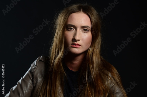 beautiful brunette in the studio on a black background