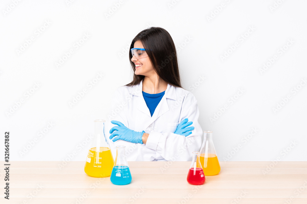 Young scientific woman in a table happy and smiling Young scientific woman in a table happy and smiling