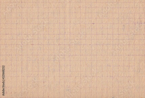 Texture of retro grey-brownish checkered paper. Leaf from a Soviet school notebook of the 1930s, background