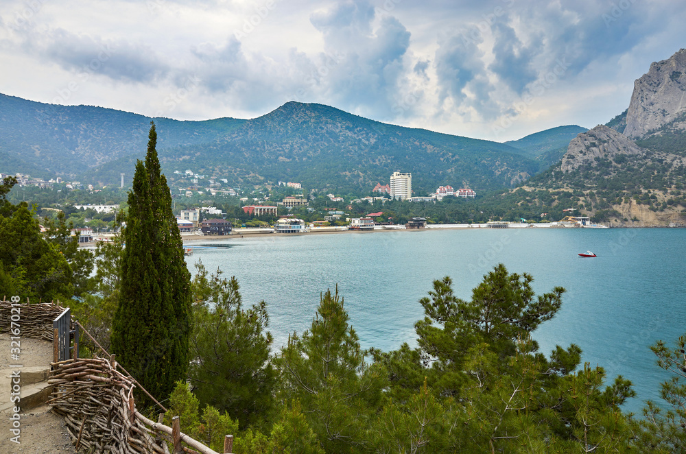 A tourist route along a trail in the mountains of the southern coast of Crimea, a beautiful view of the Black Sea and rocks in the area of the village of Novyi Svet, Republic of Crimea