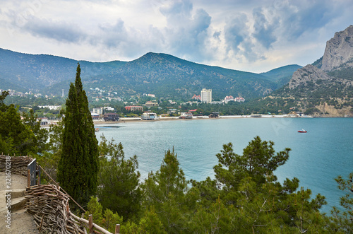 Obraz na płótnie A tourist route along a trail in the mountains of the southern coast of Crimea, a beautiful view of the Black Sea and rocks in the area of the village of Novyi Svet, Republic of Crimea w salonie