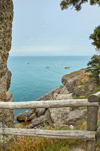 Beautiful bay, fishermen on boats. View from a mountain trail on the Black Sea coast, Novyi Svet village, Crimea
