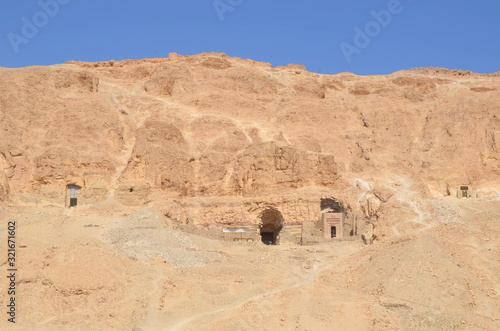 The Mortuary Temple of Hatshepesut, also known as the Djeser-Djeseru, is a mortuary temple of Ancient Egypt located in Upper Egypt. Desert and ruined area around the temple. photo