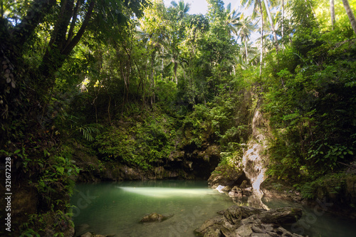 Hidden in jungles Ingkumhan waterfalls  popular tourist attraction in Dimiao  Bohol  Philippines