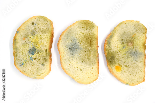 three slices of bread covered with mold isolated on a white background