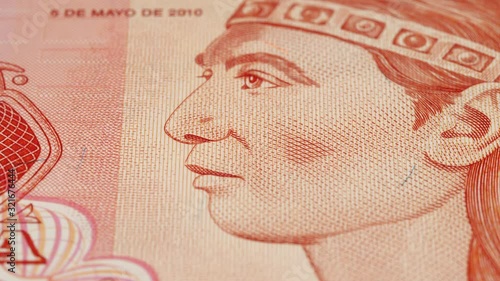 Lempira portrait on Honduran 1 lempira (2010) banknote rotating. Currency of Honduras. Low angle, macro. 4K, 422 10 bit photo
