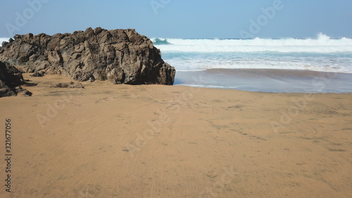 Dawn watching the waves of the sea in the Atlantic Ocean