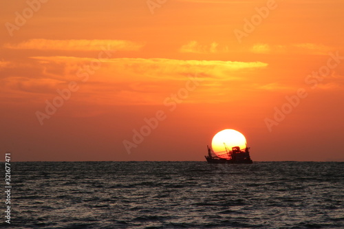 Fototapeta Naklejka Na Ścianę i Meble -  sunset boat over the sea