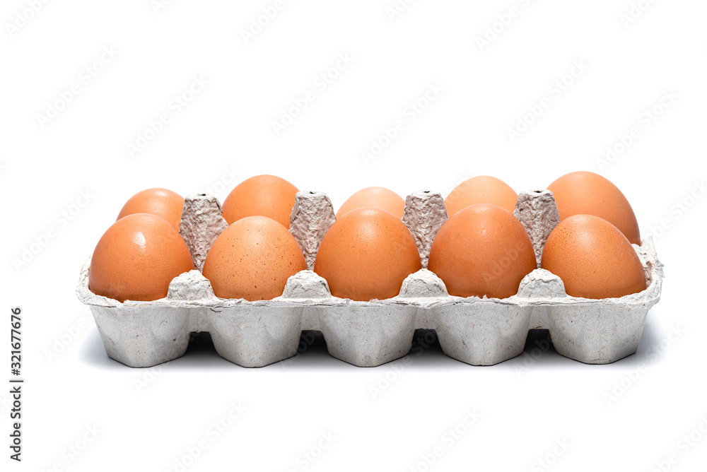 ten brown chicken eggs in a cardboard tray on a white background ten brown chicken eggs in a cardboard tray on a white background