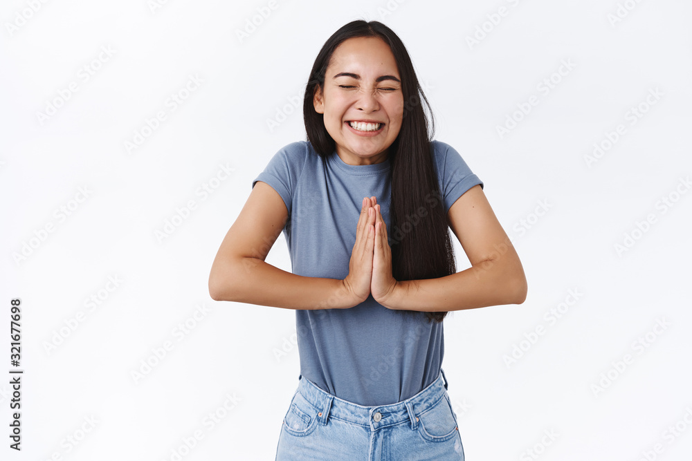 Cheerful, excited cute asian girl believe dreams come true, praying or triumphing, press hands together in pray, supplication motion, close eyes and smiling broadly, achieve success, wish fulfilled Cheerful, excited cute asian girl believe dreams come true, praying or triumphing, press hands together in pray, supplication motion, close eyes and smiling broadly, achieve success, wish fulfilled