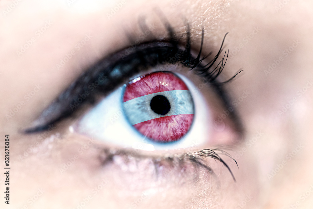 Obraz premium Flag of Austria reflects in a woman blue eye - election, sport, hope, young, generation, pride, dream, emotion, independance 