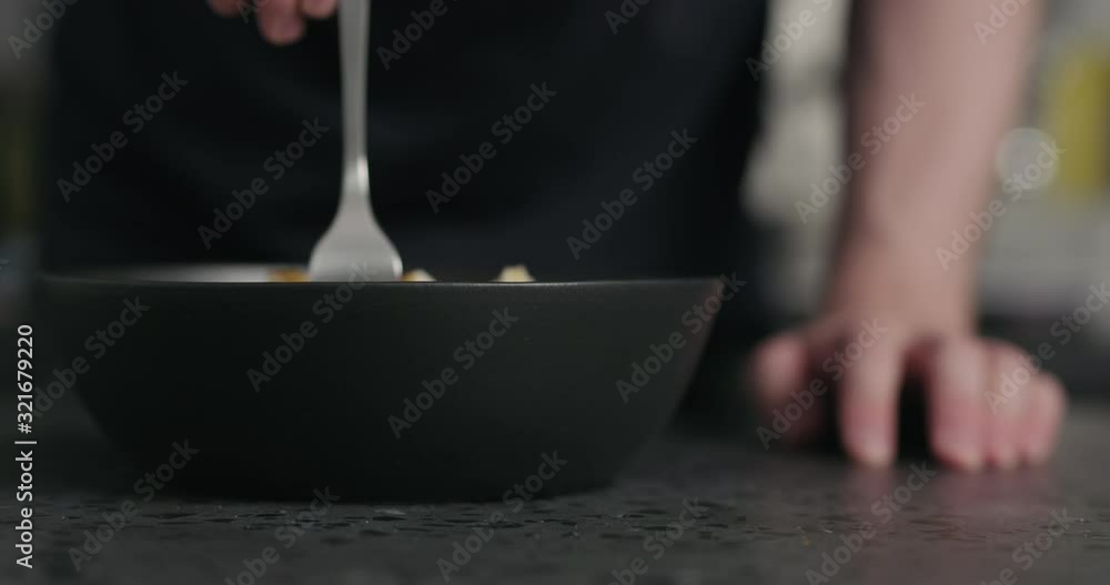 Slow motion man tasting salad Slow motion man tasting salad