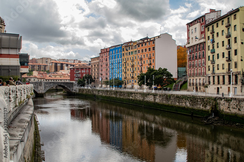 Colorful group of buildings near the river with reflection © David B.