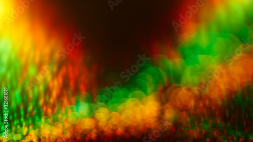 Green yellow red bokeh effect abstract background. Colored circles reggae rasta backdrop, jamaica pattern photo