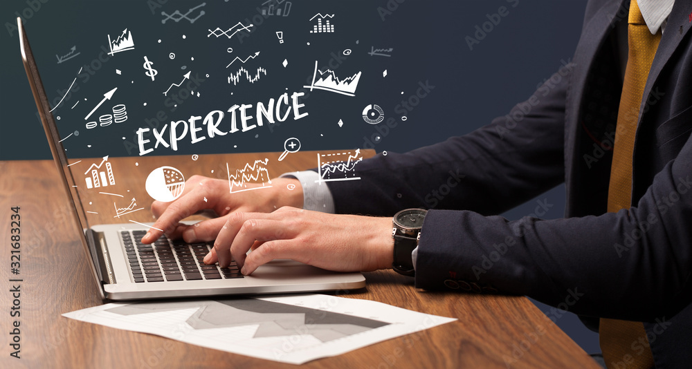Businessman working on laptop with EXPERIENCE inscription, modern business concept Businessman working on laptop with EXPERIENCE inscription, modern business concept