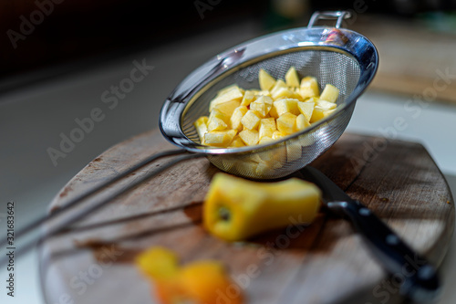 Preparing an apple for apple cakes.
