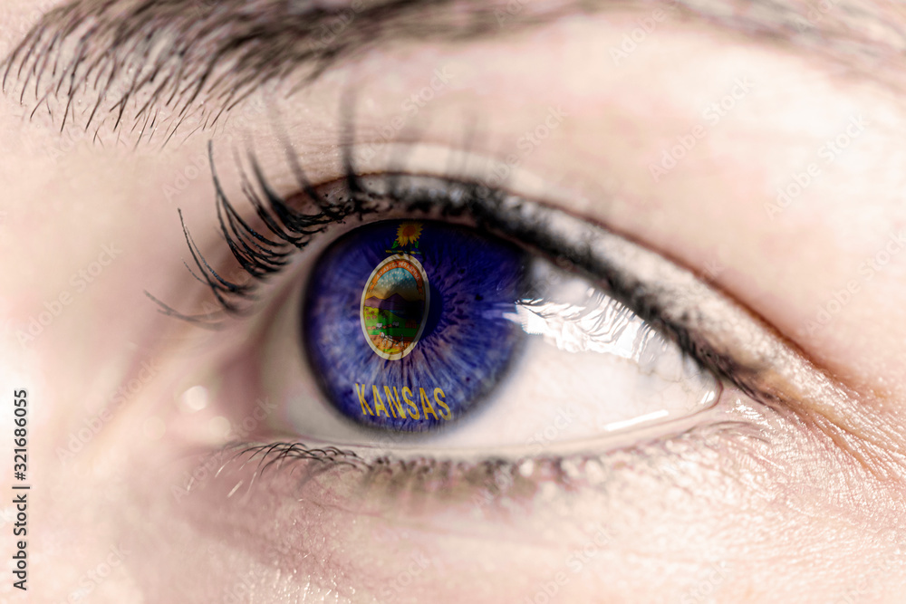 Flag of kansas state of the United States of America reflects in a man brown eye - election, sport, hope, young, generation, american football, basket Flag of kansas state of the United States of America reflects in a man brown eye - election, sport, hope, young, generation, american football, basket