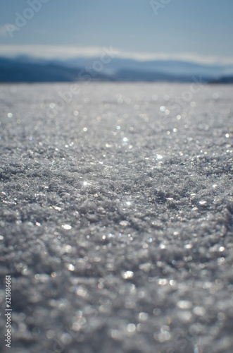 Down on the shining frozen ice of the frozen lakebed of the cold mountains. 