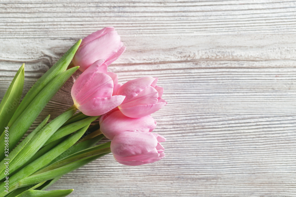 Tulips - bouquet pink tulips on wood background Tulips - bouquet pink tulips on wood background
