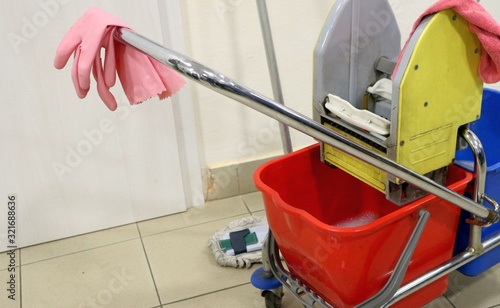 Cleaning cart and equipment, clean service tool, mop, gloves.