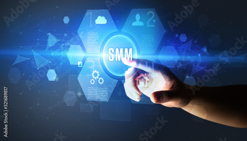Hand touching SMM inscription, new technology concept