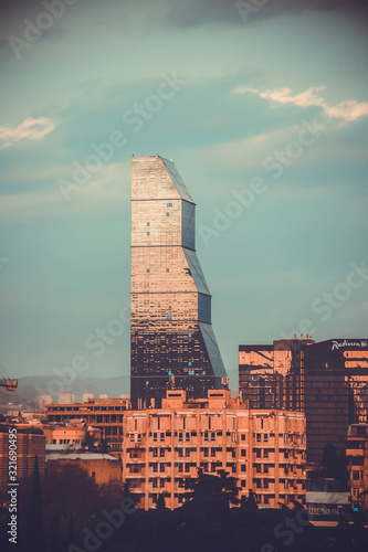 TBILISI GEORGIA - DECEMBER 25,2019. Panorama view of Tbilisi. Modern landmark - Biltmore Hotel Tbilisi photo