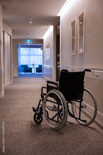 Empty wheelchair empty corridor vertical