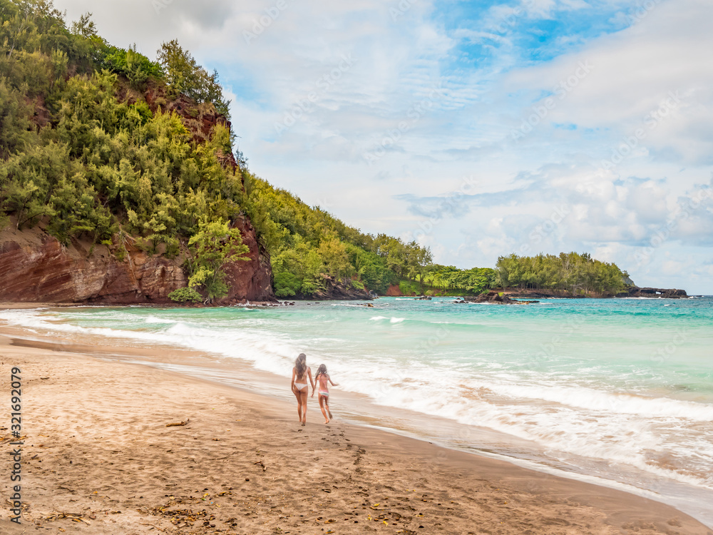 Koki Beach Park Maui. The dark red sand at Koki Beach was produced by the nearby cinder cone hill of Ka Iwi O Pele. Koki Beach is one of two famous Hana surf breaks and favorite spot for local surfers