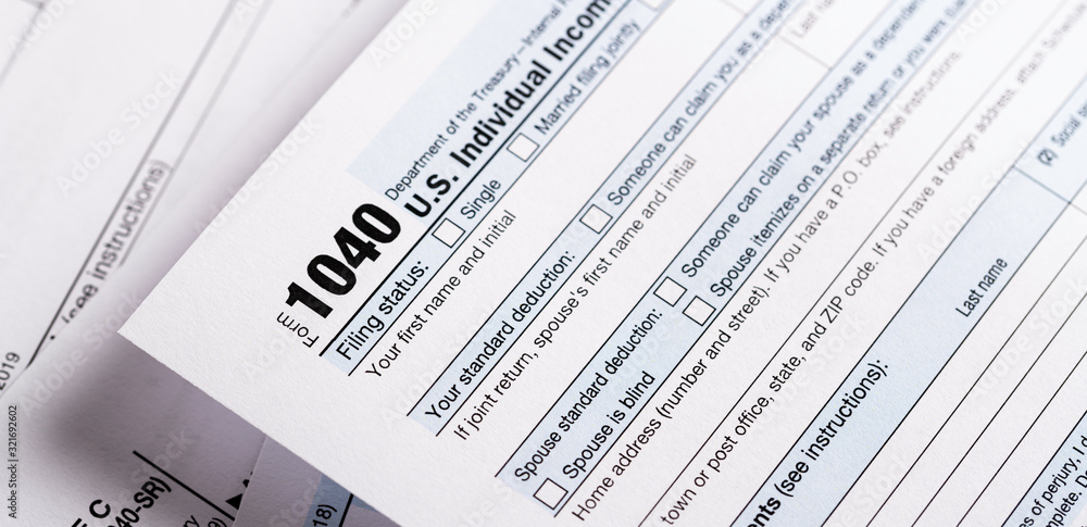 A stack of United States tax forms for individuals. A stack of United States tax forms for individuals.
