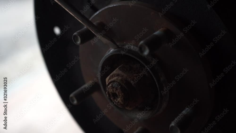 Auto mechanic cleans parts from rust. Car service. Slow motion. Auto mechanic cleans parts from rust. Car service. Slow motion.