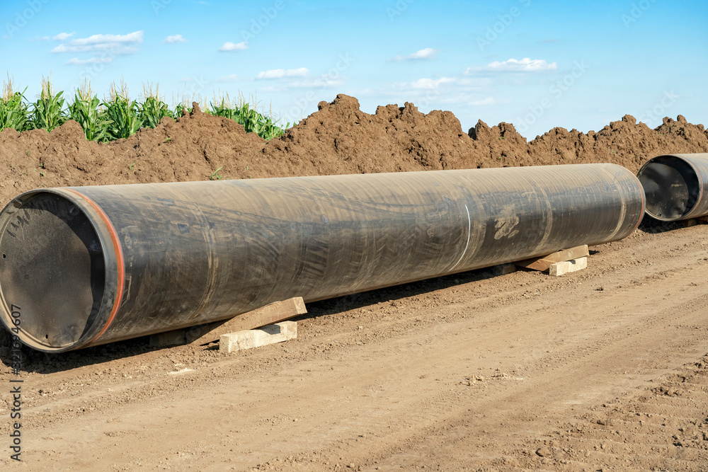 Natural Gas Pipe Sections Ready to be Assembled at Pipeline Construction Site Natural Gas Pipe Sections Ready to be Assembled at Pipeline Construction Site