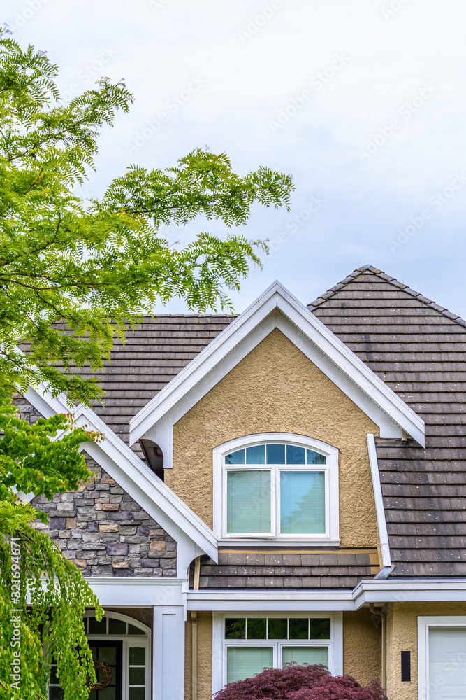 The top of the house or apartment building with nice window. The top of the house or apartment building with nice window.