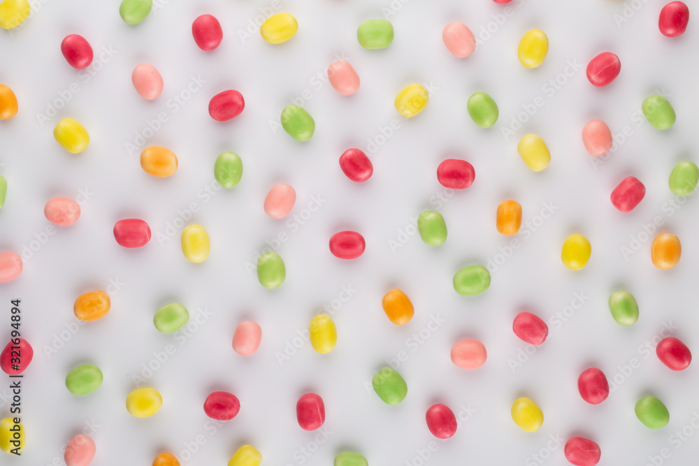 Small round candy-colored pastels on pastel background. Small round candy-colored pastels on pastel background.
