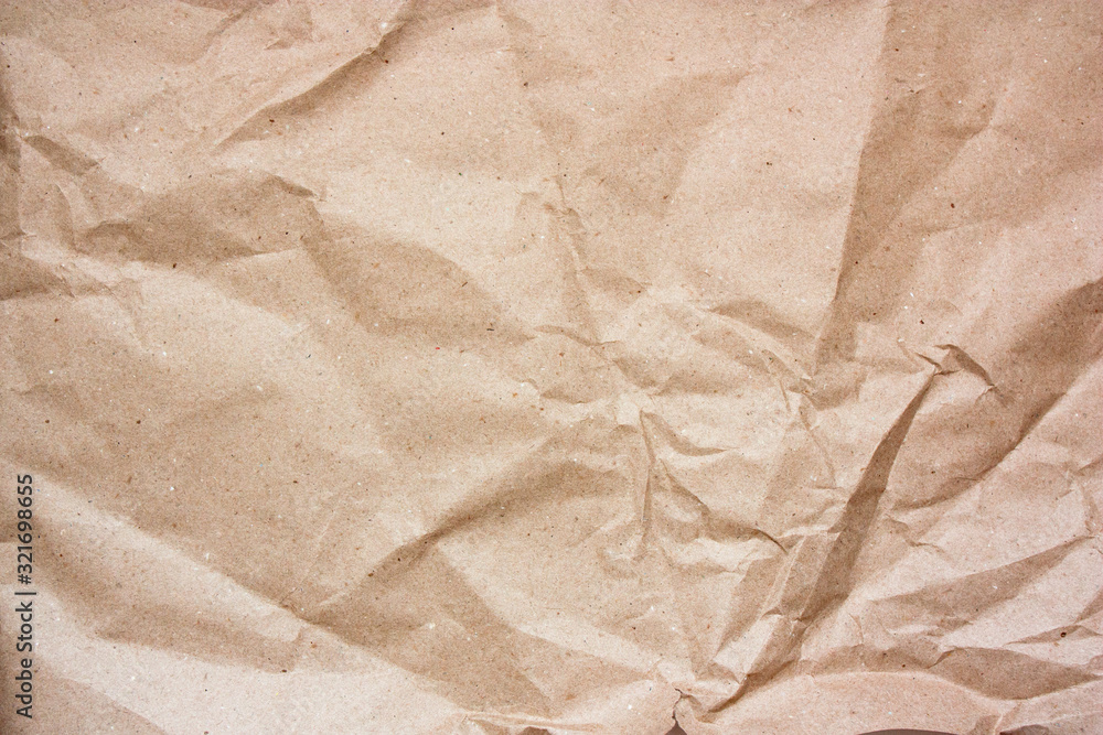 Obraz premium Brown crumpled paper texture. Kraft paper background.