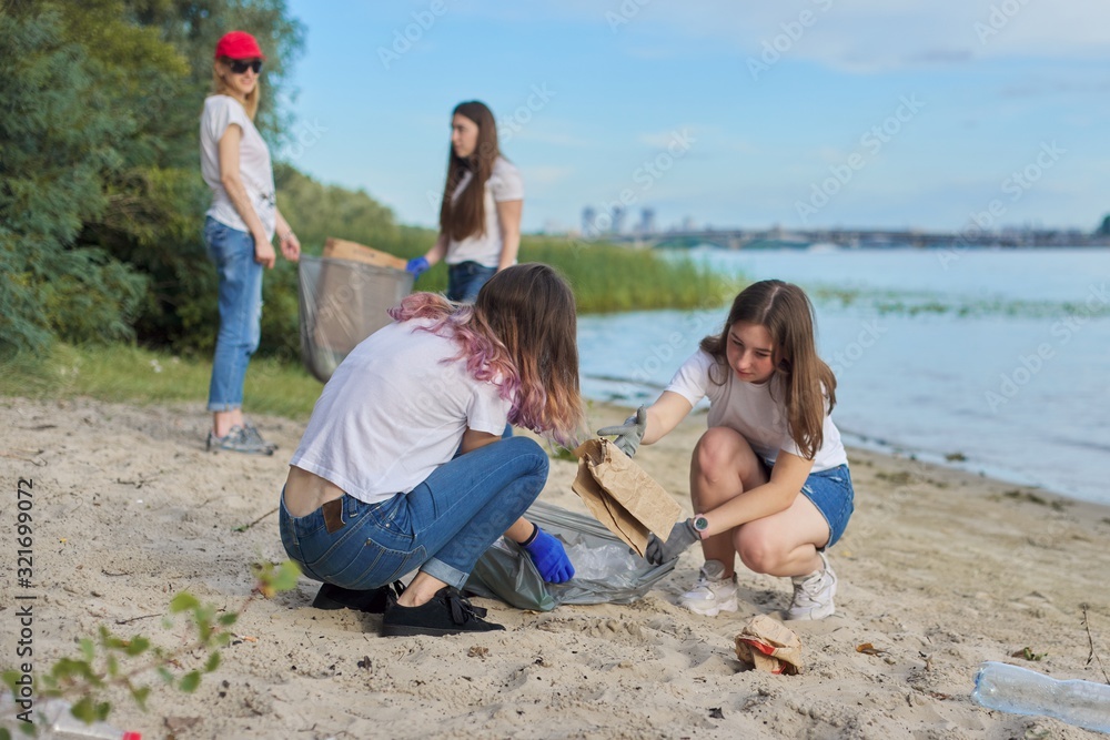 Group of students with teacher in nature doing cleaning of plastic garbage Group of students with teacher in nature doing cleaning of plastic garbage