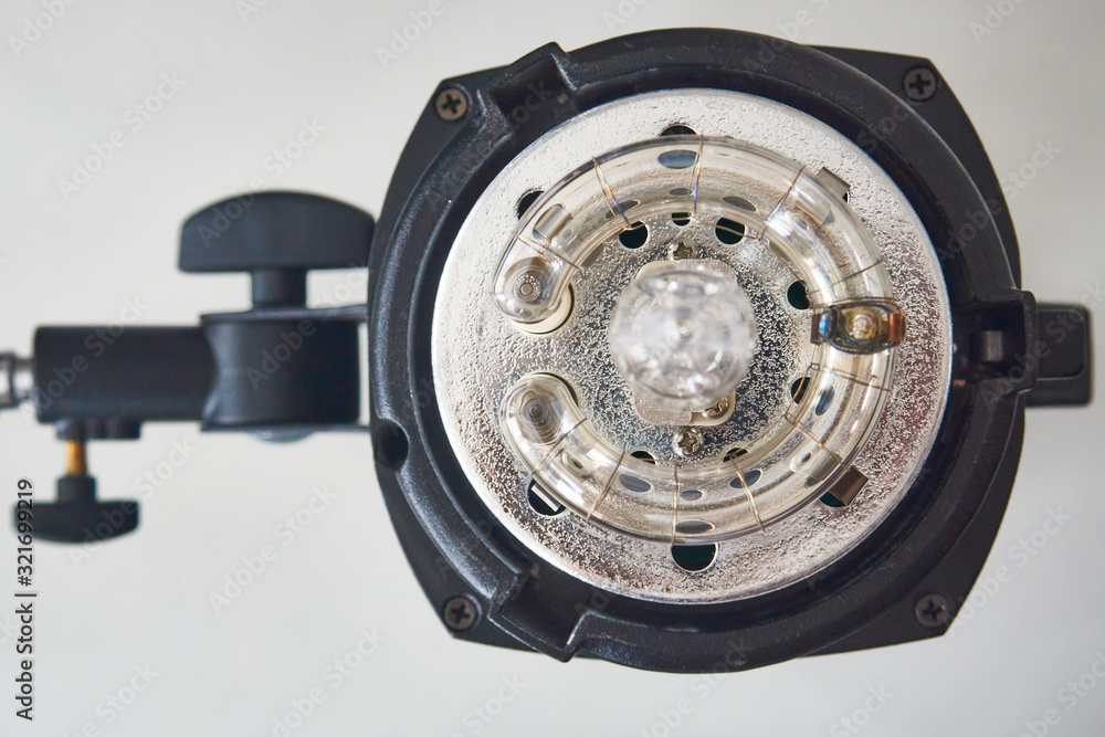 Closeup photo of studio flash light top view Closeup photo of studio flash light top view