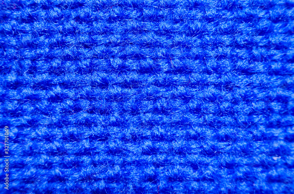 Plaid material. Blue clothes background macro Plaid material. Blue clothes background macro