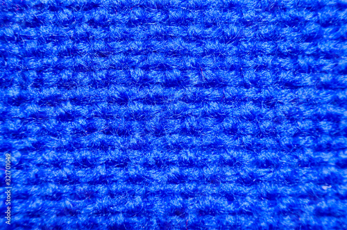 Plaid material. Blue clothes background macro