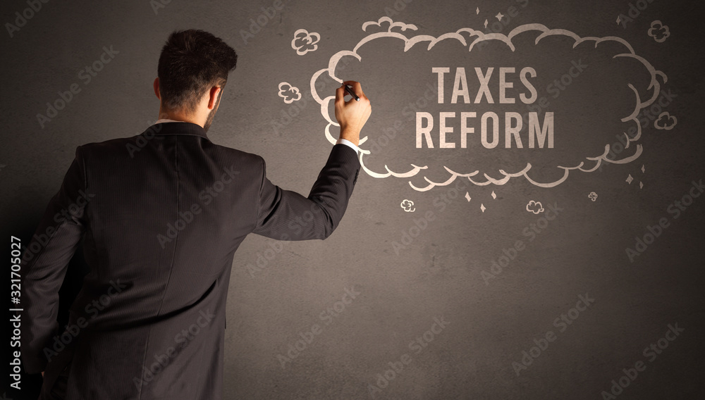 businessman drawing a cloud with TAXES REFORM inscription inside, modern business concept