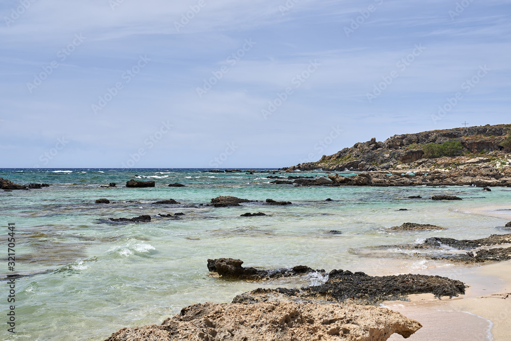 Elafonissi beach on Crete island with azure clear water, Greece, Europe. Crete is the largest and most populous of the Greek islands. Elafonissi beach on Crete island with azure clear water, Greece, Europe. Crete is the largest and most populous of the Greek islands.