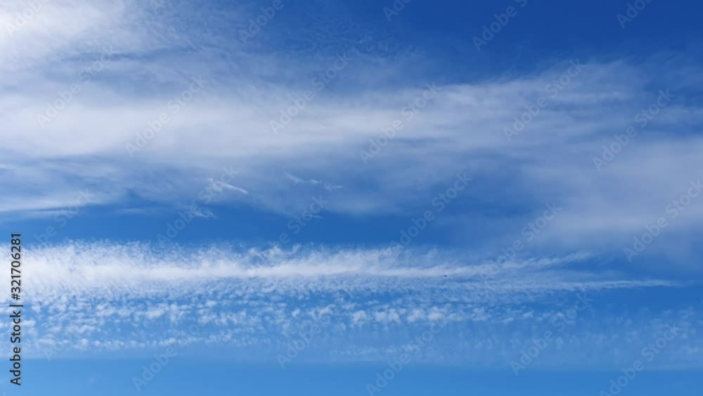 white clouds disappear in the hot sun on blue sky. Time-lapse motion clouds, blue sky background and sun white clouds disappear in the hot sun on blue sky. Time-lapse motion clouds, blue sky background and sun