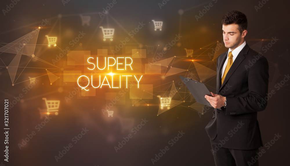 Businessman with shopping cart icons and SUPER QUALITY inscription, online shopping concept Businessman with shopping cart icons and SUPER QUALITY inscription, online shopping concept