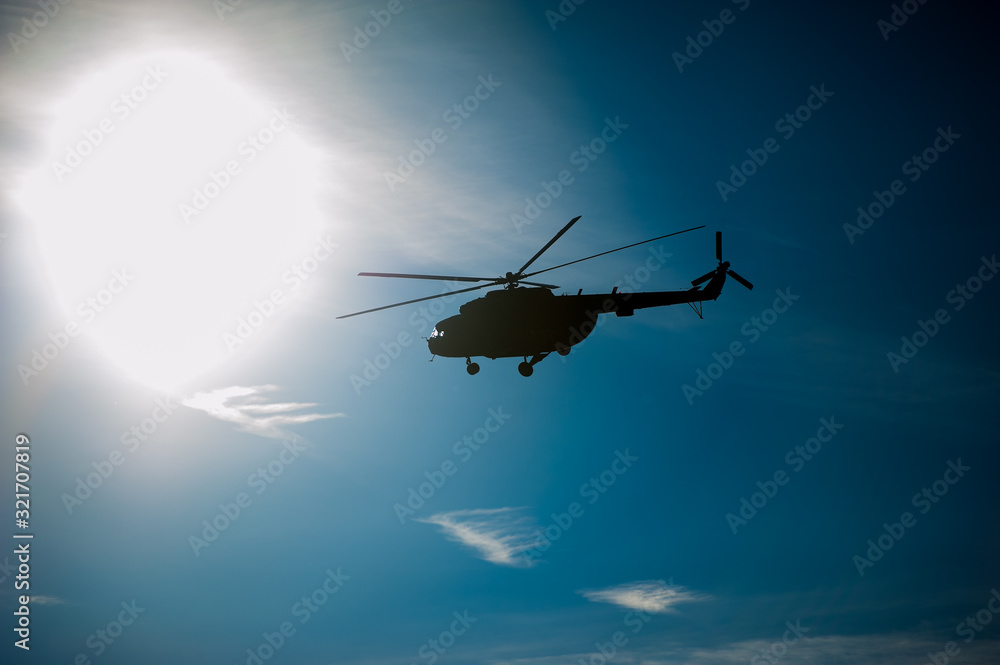 Military helicopter flying during exercise Military helicopter flying during exercise