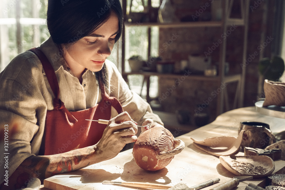 Creative, pottery and design with hands of woman in workshop studio for  molding, ceramics and art. Stock Photo by YuriArcursPeopleimages