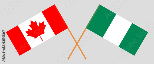 Crossed flags of Nigeria and Canada