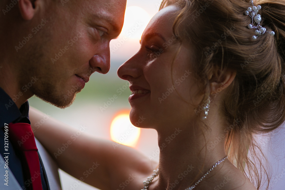 Naklejka premium a couple in love kissing. husband and wife portrait photo